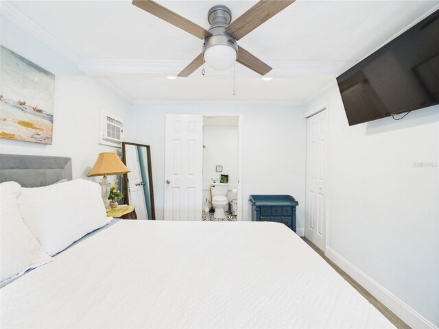 2222 12th St NW, Winter Haven, FL 33881 - bedroom with baseboards, ornamental molding, connected bathroom, ceiling fan, and a closet