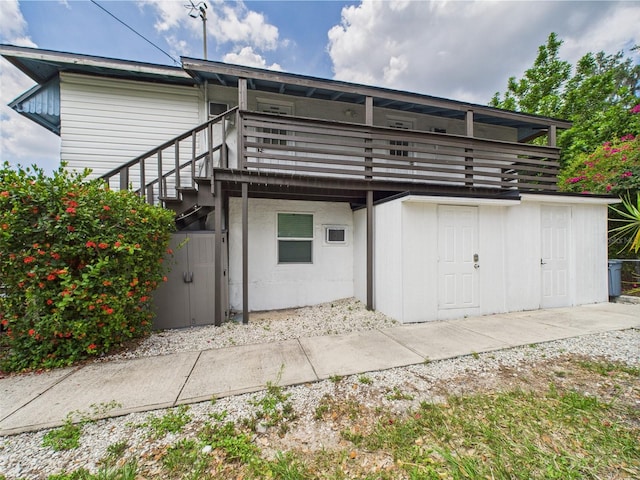 2222 12th St NW, Winter Haven, FL 33881 - back of house featuring stairway and a deck