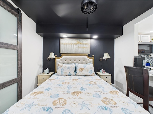 2222 12th St NW, Winter Haven, FL 33881 - bedroom with baseboards and a barn door