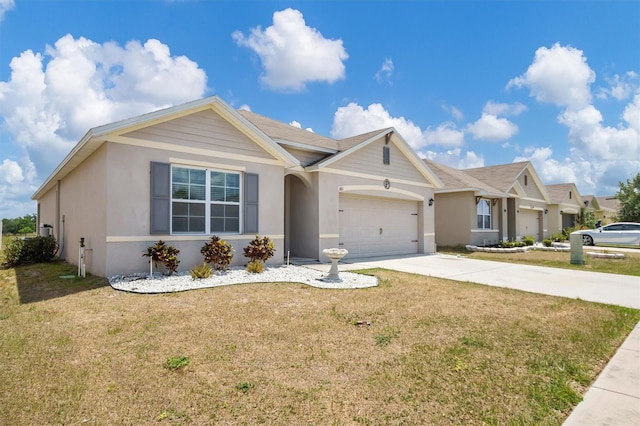 ranch-style home featuring a garage, stucco siding, driveway, and a front lawn