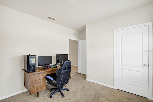 office space featuring light colored carpet, baseboards, and visible vents