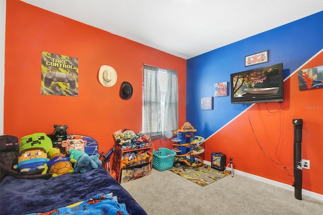 bedroom with carpet floors and baseboards