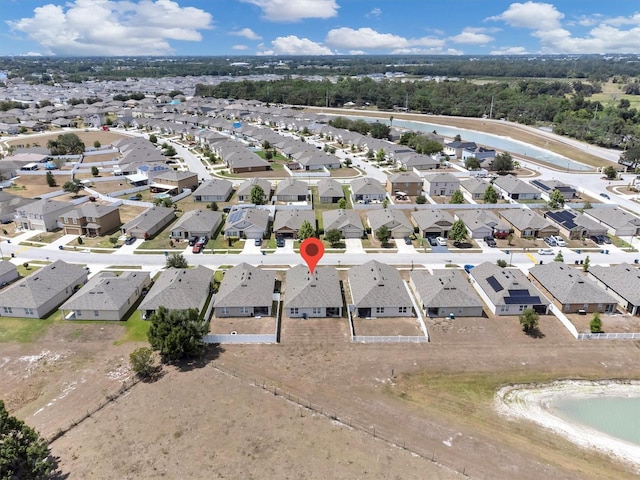 bird's eye view with a water view and a residential view