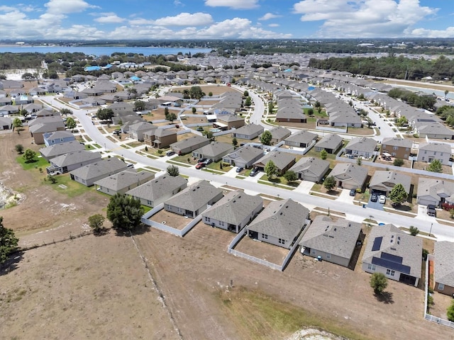 aerial view with a water view and a residential view