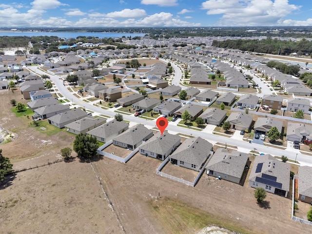 aerial view featuring a residential view and a water view