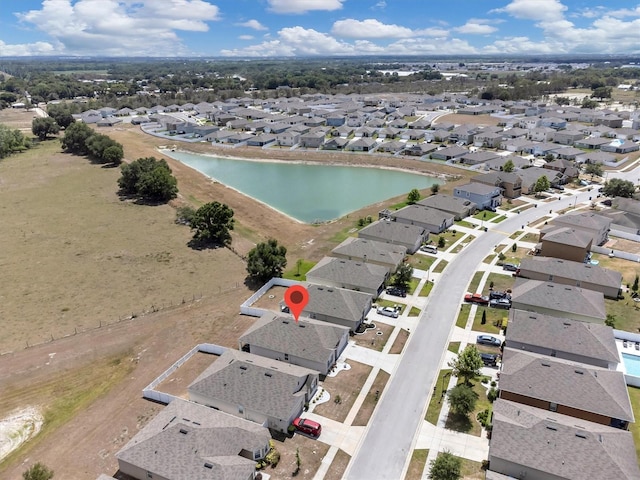 bird's eye view with a residential view and a water view