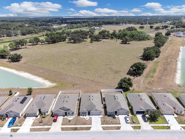 birds eye view of property with a residential view and a water view