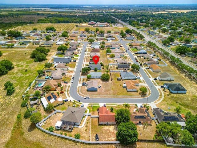 birds eye view of property with a residential view