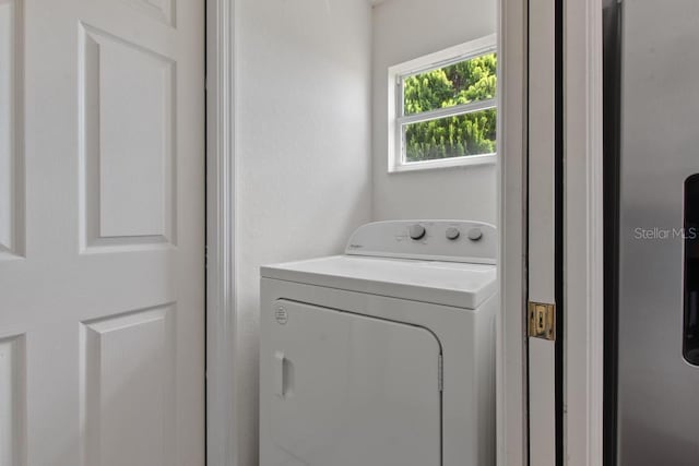 laundry area featuring washer / dryer and laundry area