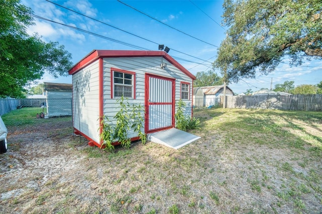 view of shed with a fenced backyard