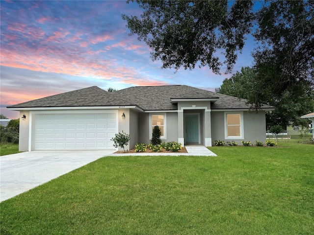 4007 Loretto Ave, Sebring, FL 33872 - view of front of house featuring concrete driveway, stucco siding, roof with shingles, a garage, and a front yard