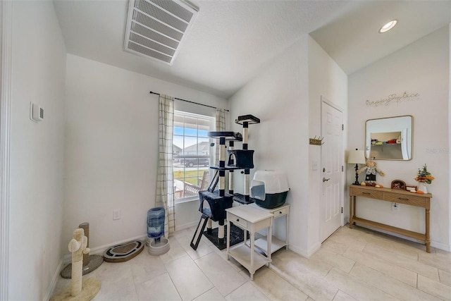 interior space featuring baseboards and visible vents
