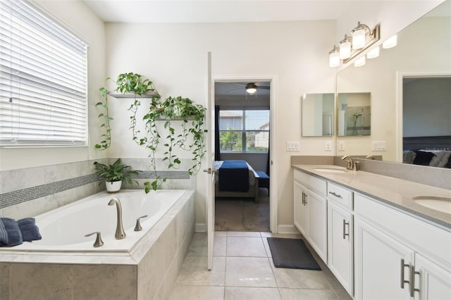 full bathroom with double vanity, a sink, a bath, and ensuite bath