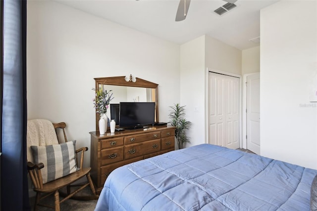 bedroom with carpet floors, a ceiling fan, a closet, and visible vents