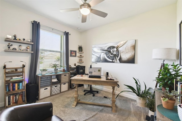 office with baseboards, ceiling fan, and light carpet