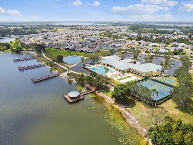 drone / aerial view featuring a water view and a residential view