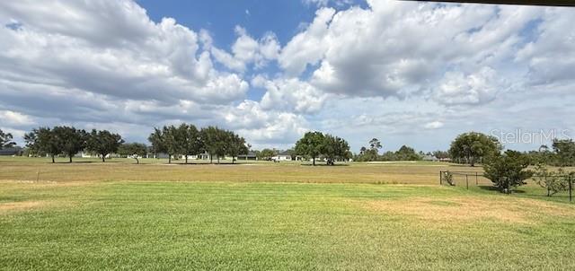view of home's community featuring a lawn