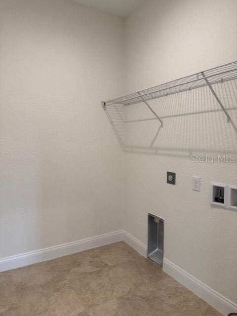 laundry area featuring laundry area, baseboards, washer hookup, and electric dryer hookup