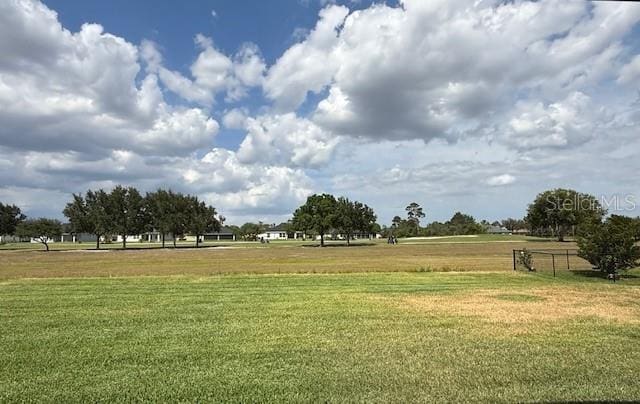 view of property's community featuring a lawn