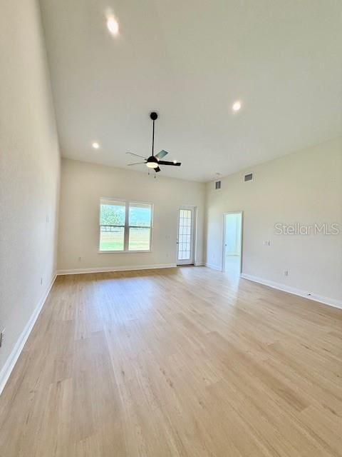 5275 Pebble Beach Dr, Sebring, FL 33872 - unfurnished living room featuring ceiling fan, visible vents, baseboards, and light wood-type flooring