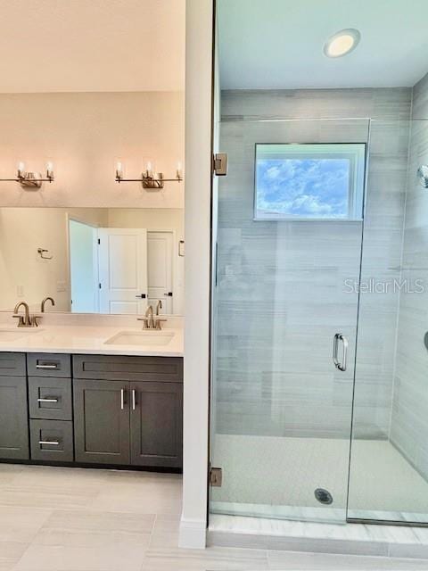 5275 Pebble Beach Dr, Sebring, FL 33872 - bathroom featuring double vanity, a sink, a stall shower, and tile patterned flooring