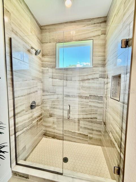 bathroom featuring a stall shower