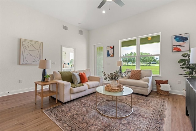 5277 Pebble Beach Dr, Sebring, FL 33872 - living room featuring a ceiling fan, wood finished floors, a high ceiling, and recessed lighting