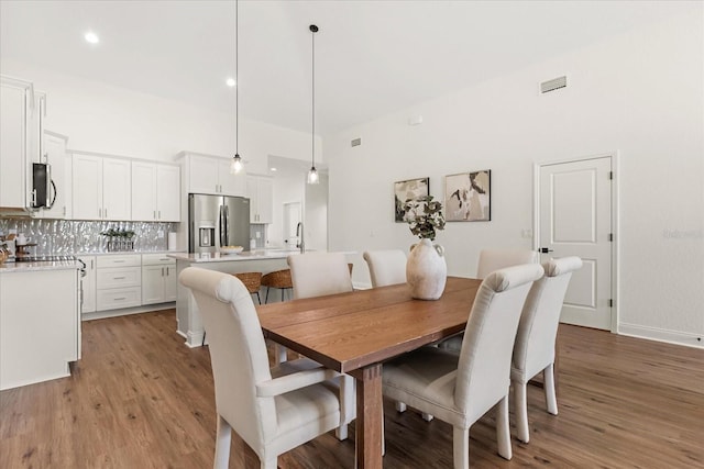 5277 Pebble Beach Dr, Sebring, FL 33872 - dining space featuring light wood-type flooring