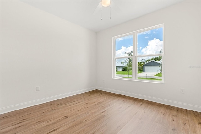 5277 Pebble Beach Dr, Sebring, FL 33872 - spare room with light wood-style floors and ceiling fan