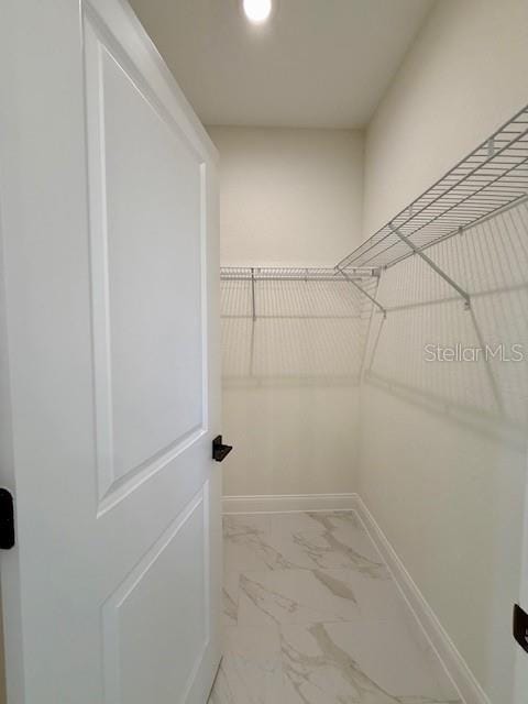 5273 Pebble Beach Dr, Sebring, FL 33872 - spacious closet with marble finish floor