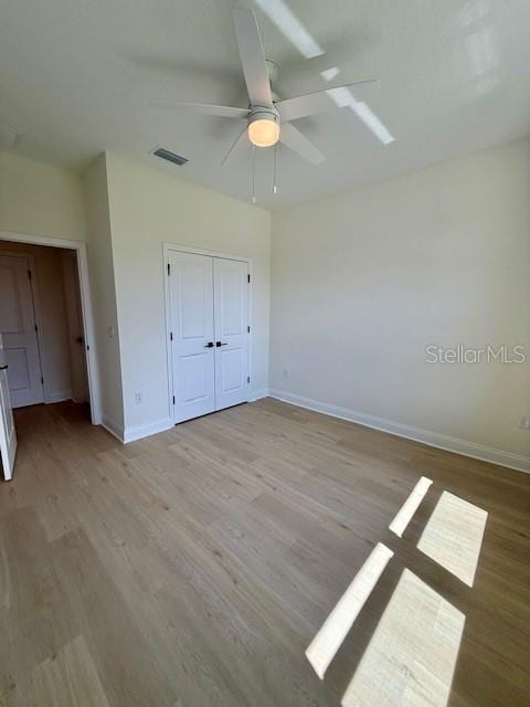 5273 Pebble Beach Dr, Sebring, FL 33872 - unfurnished bedroom featuring baseboards, visible vents, and light wood-style flooring