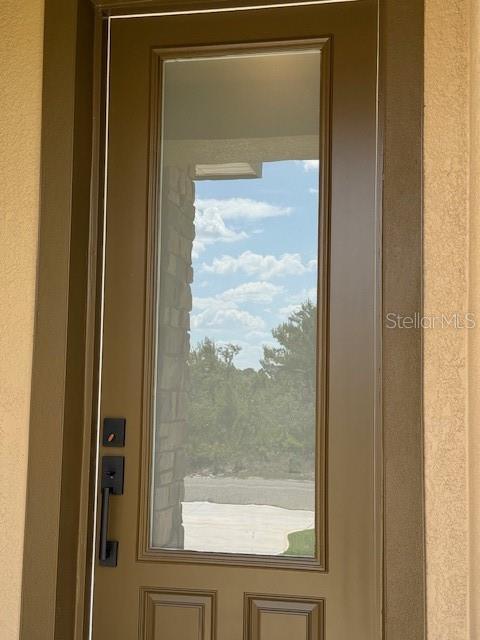 5273 Pebble Beach Dr, Sebring, FL 33872 - doorway to outside with a healthy amount of sunlight