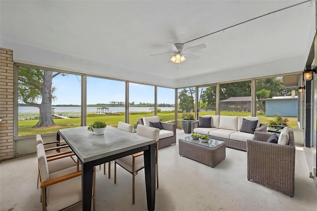 sunroom / solarium featuring an outdoor hangout area, a water view, a ceiling fan, and outdoor dining space