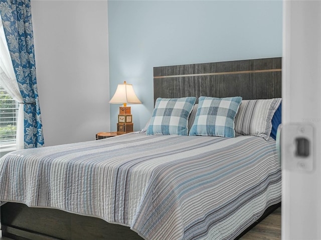 bedroom with wood finished floors