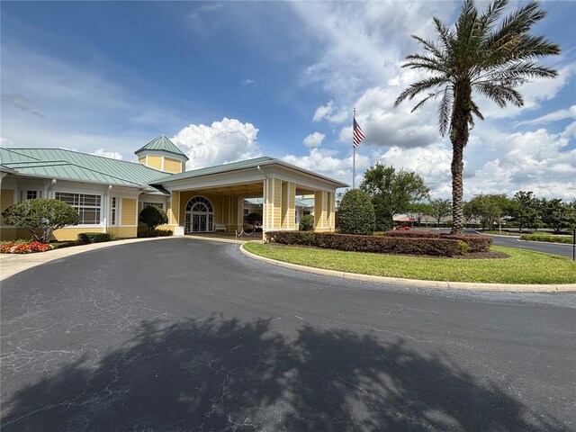 view of property with aphalt driveway