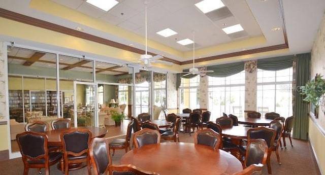 dining space with a tray ceiling