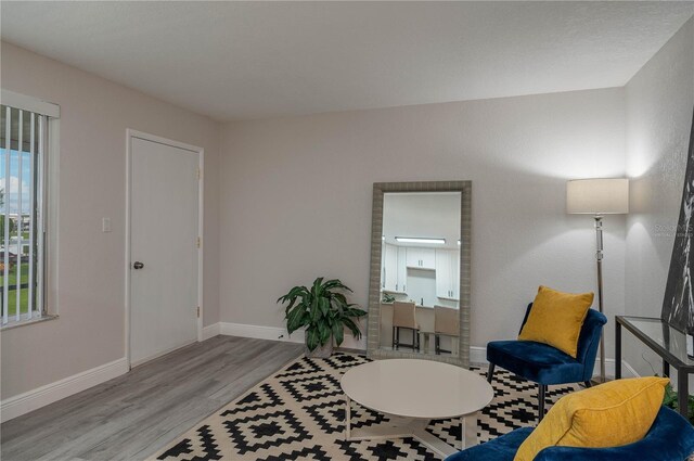 1700 6th St NW Unit C26, Winter Haven, FL 33881 - living area with wood finished floors and baseboards