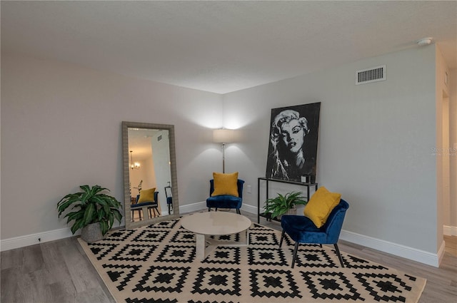 1700 6th St NW Unit C26, Winter Haven, FL 33881 - sitting room featuring wood finished floors and baseboards