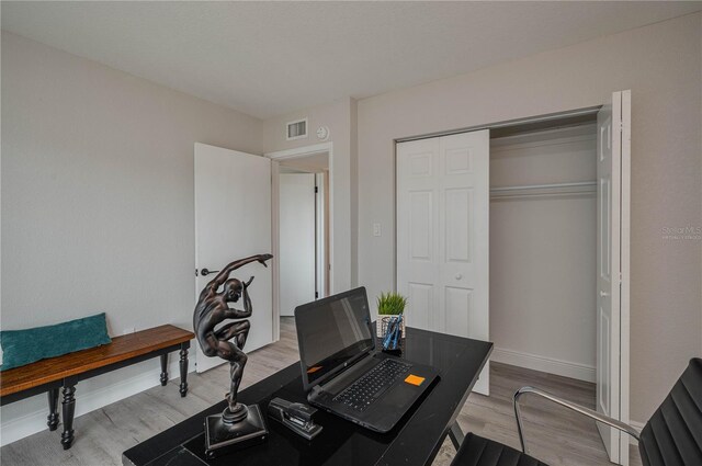1700 6th St NW Unit C26, Winter Haven, FL 33881 - home office featuring light wood-type flooring and baseboards