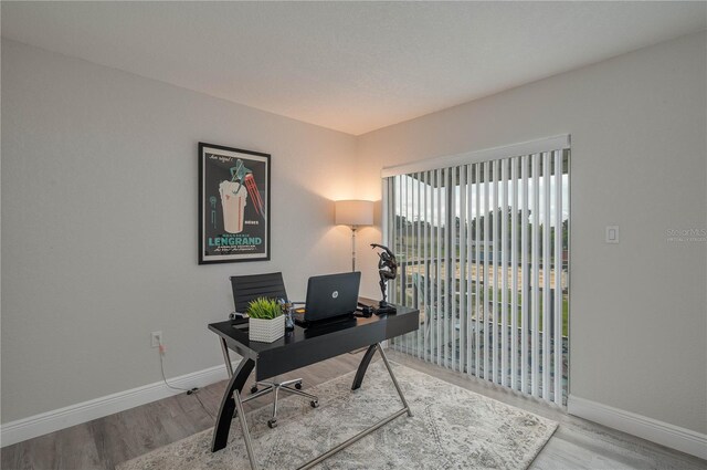 1700 6th St NW Unit C26, Winter Haven, FL 33881 - home office featuring wood finished floors and baseboards