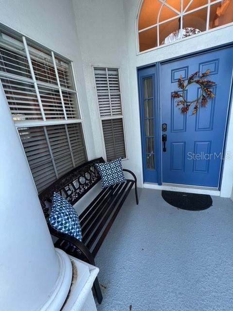 135 Minniehaha Cir, Haines City, FL 33844 - entrance to property featuring stucco siding