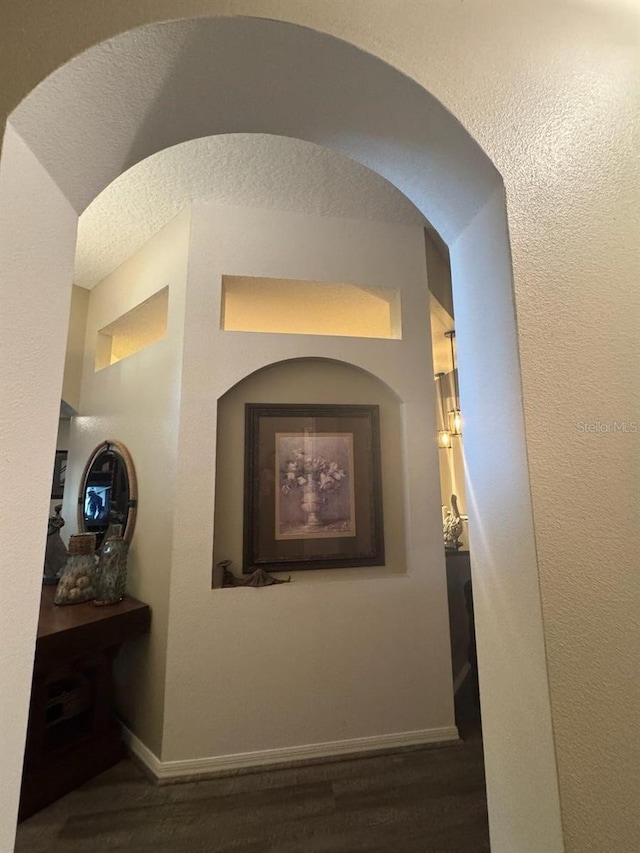 135 Minniehaha Cir, Haines City, FL 33844 - corridor featuring wood finished floors and baseboards