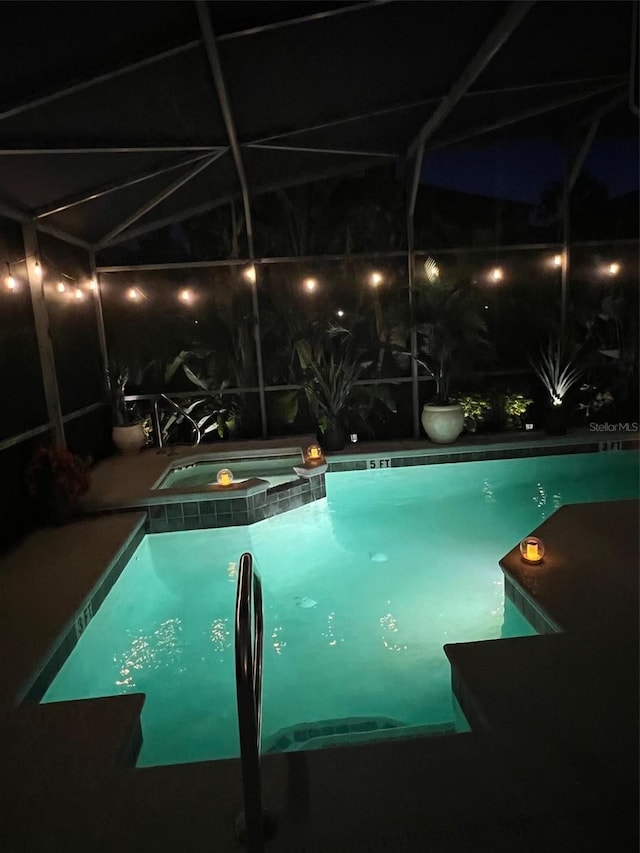 135 Minniehaha Cir, Haines City, FL 33844 - view of pool featuring a pool with connected hot tub and glass enclosure