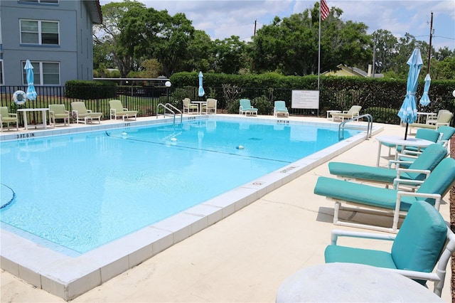 333 Lake Howard Dr NW Unit 103C, Winter Haven, FL 33880 - community pool with fence and a patio area