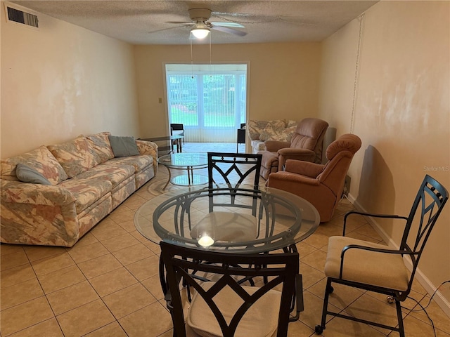 333 Lake Howard Dr NW Unit 103C, Winter Haven, FL 33880 - living room with ceiling fan, a textured ceiling, and light tile patterned floors
