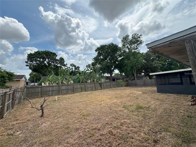 view of yard featuring a sunroom