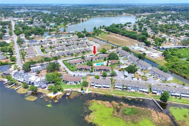 view of property location with a nearby body of water and nearby suburban area