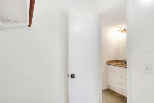bathroom featuring vanity and tile patterned flooring