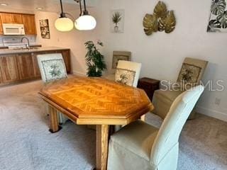 133 Palm View Ct Unit 3513/4, Haines City, FL 33844 - dining room featuring light colored carpet and baseboards