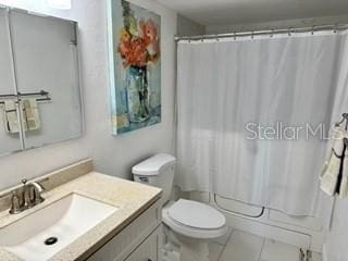 133 Palm View Ct Unit 3513/4, Haines City, FL 33844 - full bathroom with toilet, vanity, shower / bath combination with curtain, and tile patterned flooring
